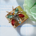 Rainbow Bug Napkin Rings, Topaz - The Emperor's Lane